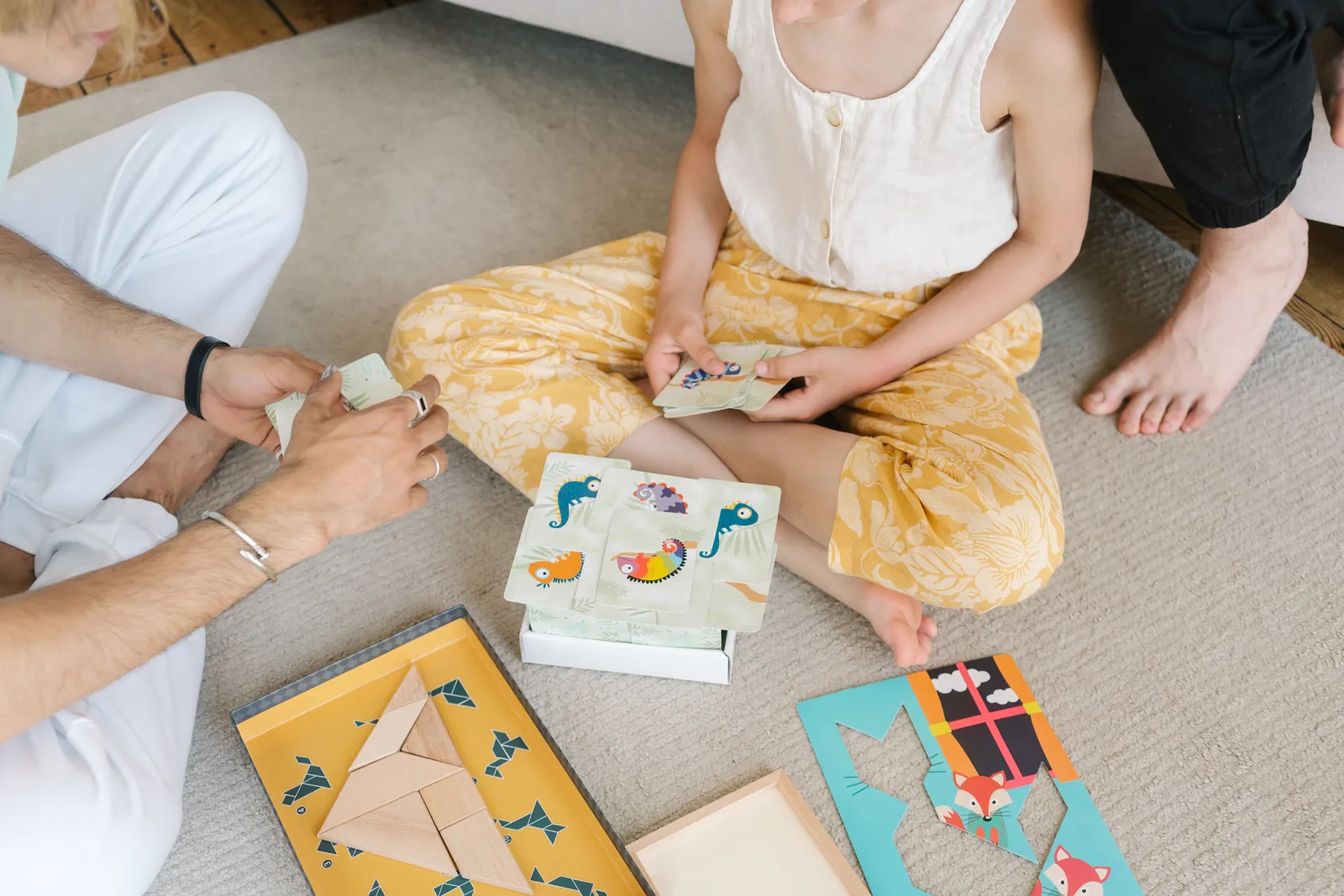 Family using educational puzzles and card games