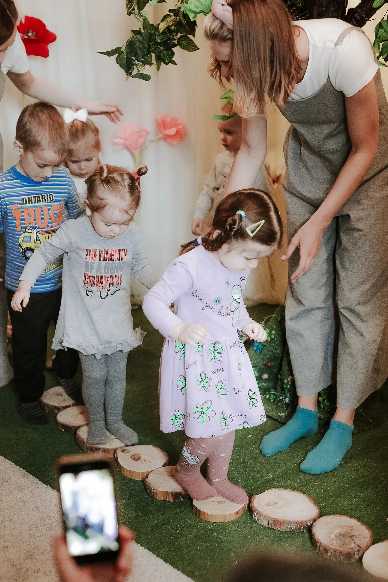 Children participating in a guided movement and balance activity