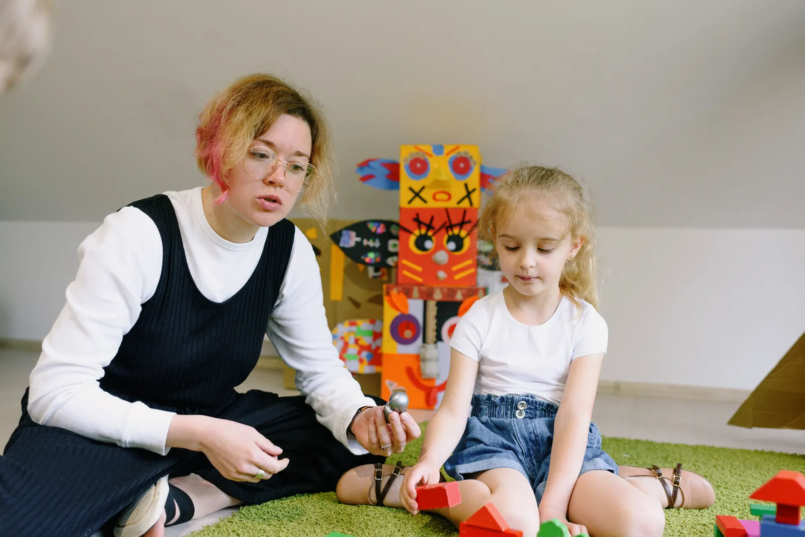 Adult and child taking part in a one-to-one guided play activity